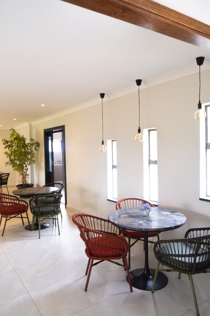 Dining area with contemporary lighting